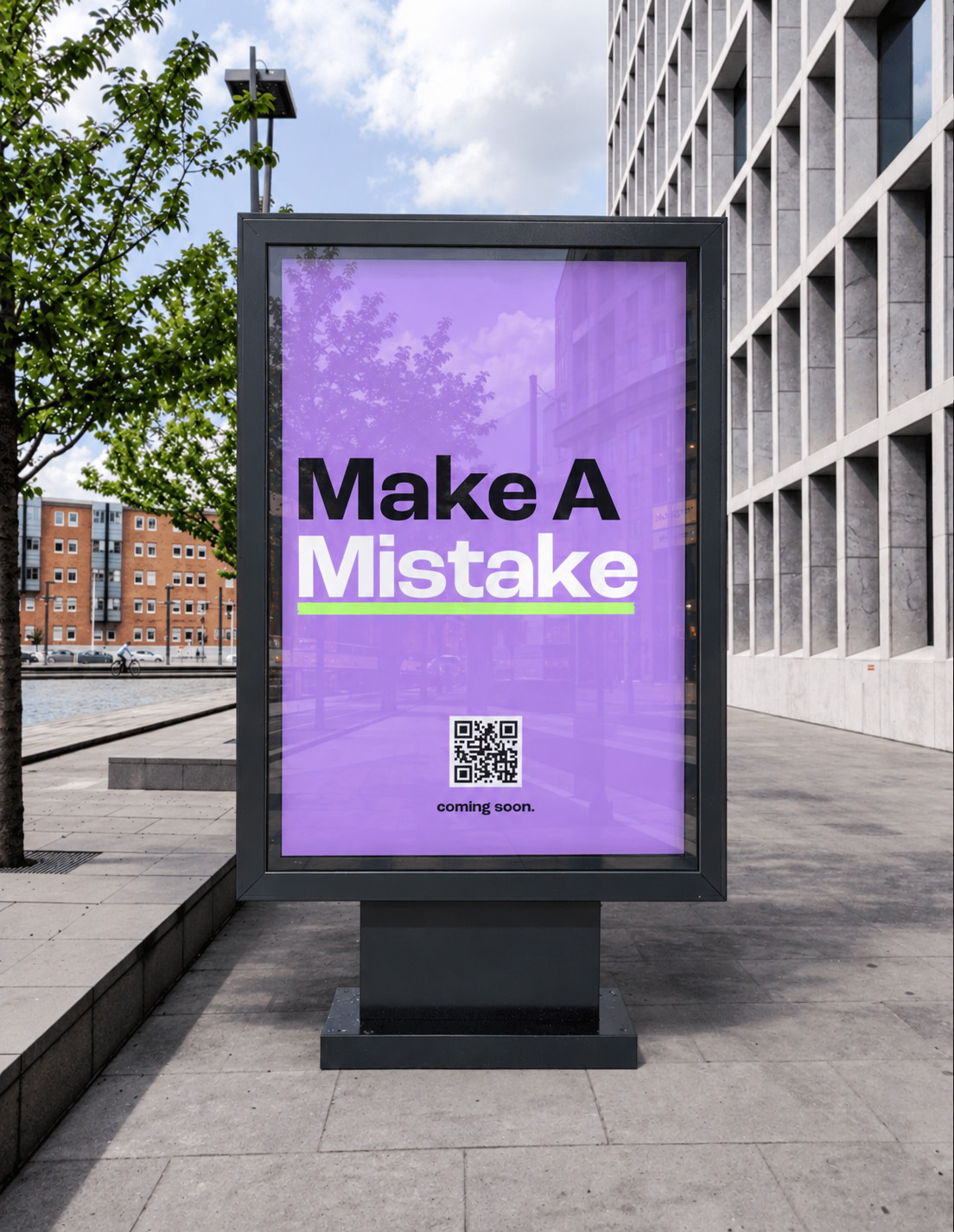 'Make A Mistake' poster displayed on a street billboard